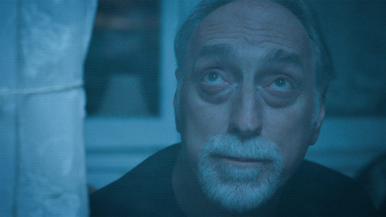 Blue tinted closeup of a man